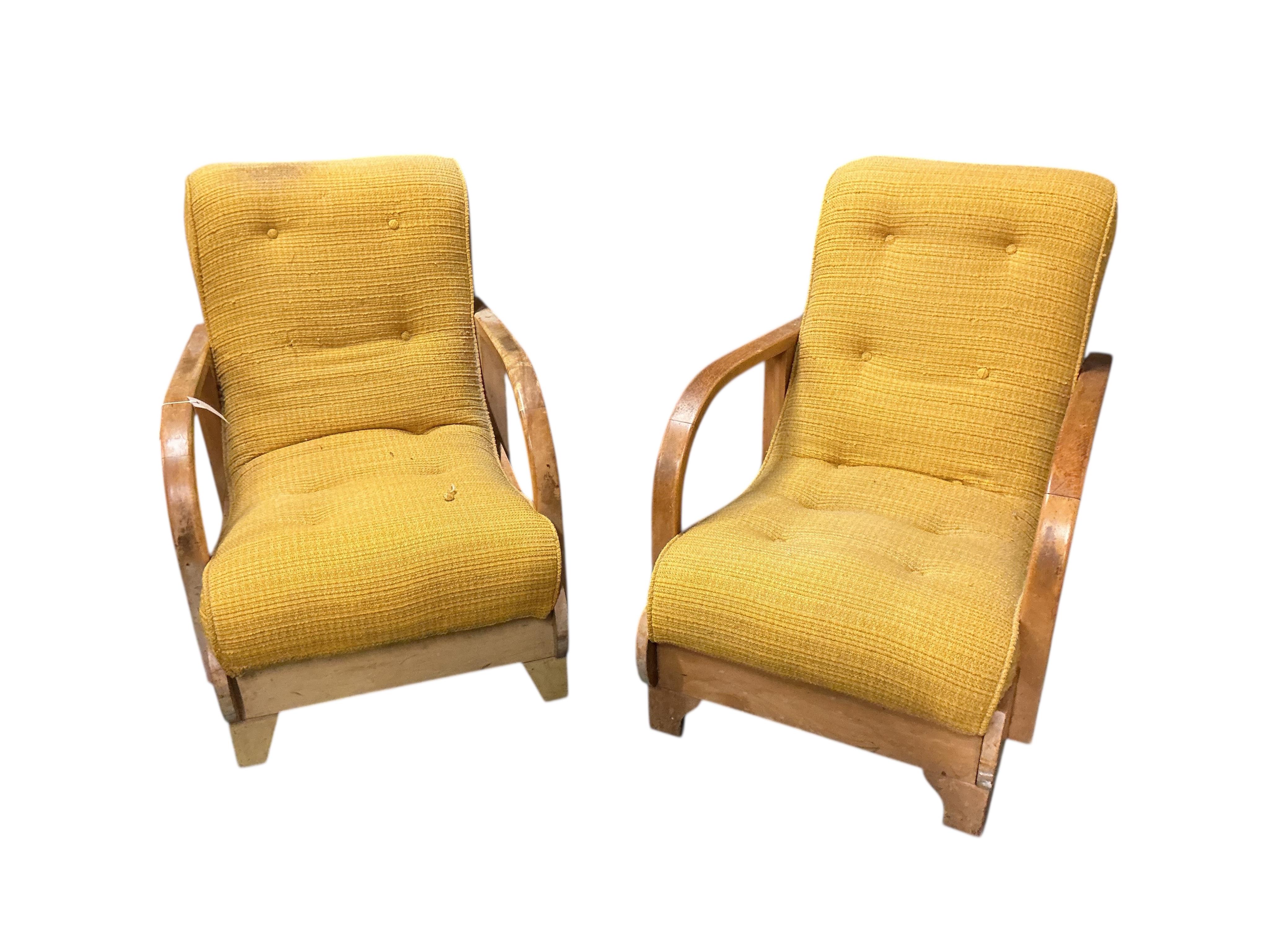 In the manner of Gerard Summers: A pair of mid century teak lounge chairs, width 57cm, depth 82cm, height 82cm